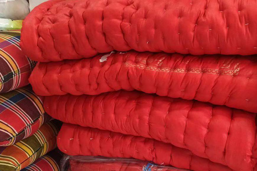 Tales and memories woven in the brick-red quilts - a Bengal staple